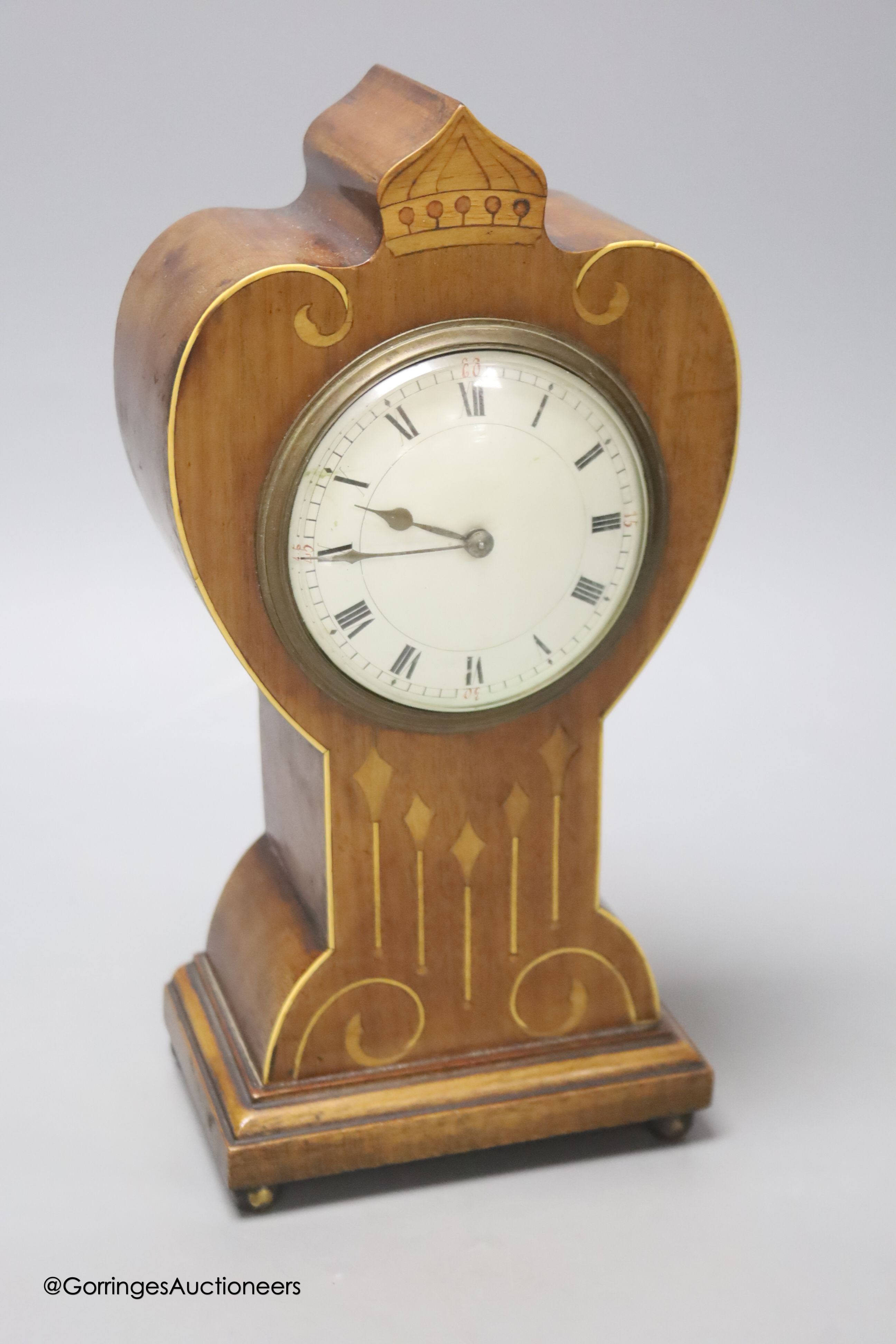 A French Art Nouveau mahogany and marquetry mantel timepiece, height 26cm